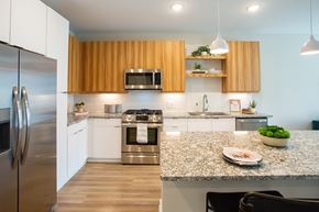 Atlanta apartment for rent - a modern kitchen with stainless steel appliances and granite counter tops
