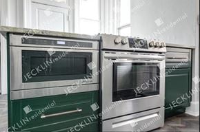 Richmond house for rent - Two ovens are in a kitchen, one is black and the other is silver.