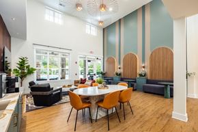 Charlotte apartment for rent - A modern dining room with a large table and chairs.