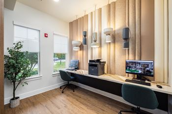 Brand new business center with computers and wireless printing