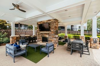 Summerhouse with fireplace, tv, and grills