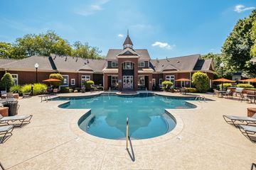 Huntersville townhouse for rent - A large swimming pool in front of a house.