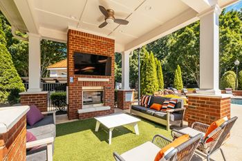 Summerhouse with fireplace, tv, and grills