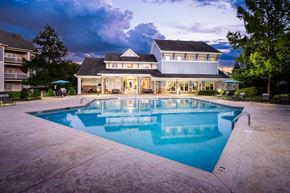 Charlotte apartment for rent - A large house with a pool in the backyard.