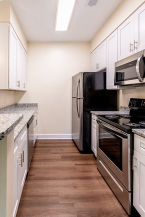 Cornelius apartment for rent - a kitchen with stainless steel appliances and white cabinets