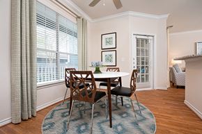Charlotte apartment for rent - a dining room with a table and chairs and a large window