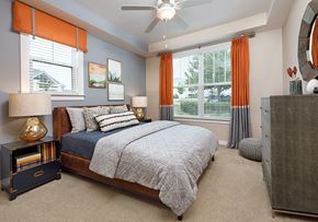 Concord apartment for rent - a bedroom with a bed and a ceiling fan