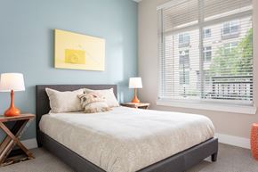 Nashville apartment for rent - a bedroom with a bed and a large window