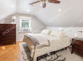 Richmond house for rent - a bedroom with a bed and a ceiling fan