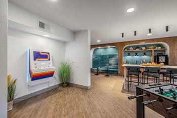 24-Hour game room with billiards, foosball, and vintage arcade games