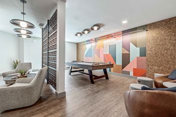 24-Hour game room with billiards, foosball, and vintage arcade games
