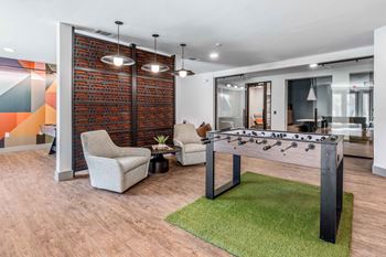 24-Hour game room with billiards, foosball, and vintage arcade games