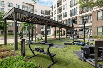 North building: 24-hour cardio & strength training fitness center with peloton bike, peloton row, pilates reformer, trx training equipment, yoga and stretching area, with outdoor fitness center