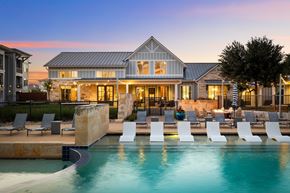 Round Rock apartment for rent - A large house with a pool in front of it.