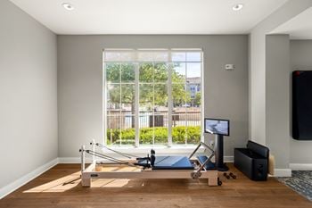 Cycling and yoga studio with pilates reformer
