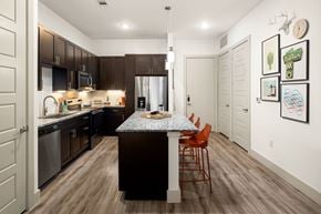 Austin apartment for rent - A kitchen with a table and chairs in the middle of the room.