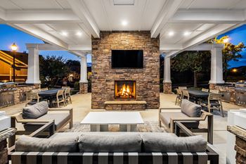 Summerhouse with fireplace, tvs, and grills