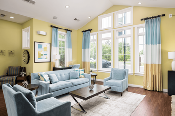 Concord apartment for rent - A living room with a blue couch and a coffee table.