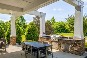 Summerhouse with fireplace, tvs, and grills