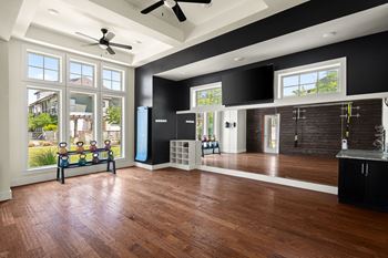 24-Hour cardio/strength training fitness center with yoga/aerobics area and gym studios
