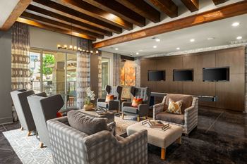 Resident game lounge with billiards, shuffleboard, and arcade games