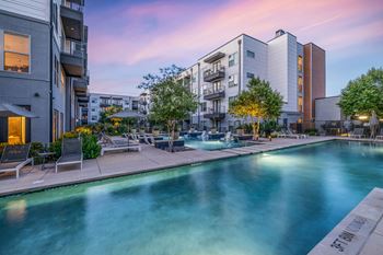 Resort-style swimming pool with fountains