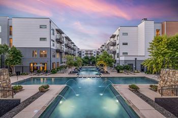 Resort-style swimming pool with fountains