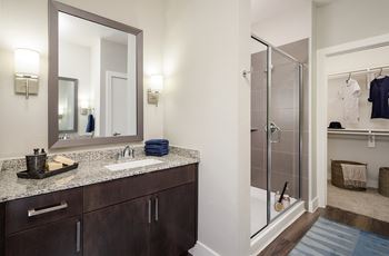 Burl ray model bath with standalone glass shower enclosure