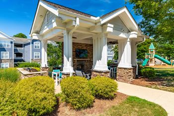 Summerhouse with fireplace, tv, and grills