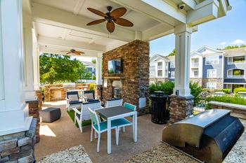 Summerhouse with fireplace, tv, and grills