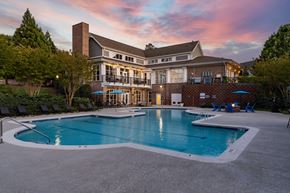Raleigh apartment for rent - A large house with a pool in front.