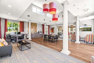 Raleigh apartment for rent - A living room with a grey couch and a coffee table.
