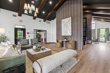 Wake Forest apartment for rent - A living room with a large couch and a coffee table.