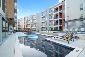 Multi-tiered resort waterfall-style swimming pool