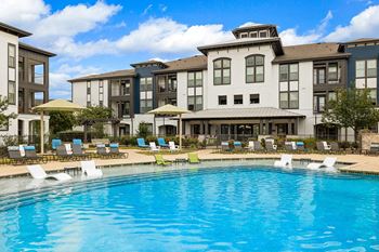 Resort-style pool with sun lounge, relaxing cabanas, and wi-fi