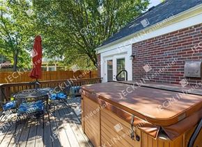 Richmond house for rent - a backyard with a hot tub and a table and chairs