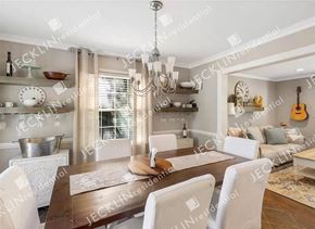 Richmond house for rent - a dining room with a table and chairs and a chandelier