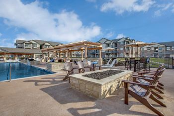 Poolside fire pit with comfy seating
