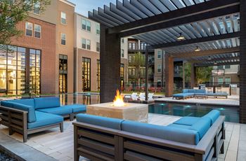 Poolside fire pit with cozy seating area