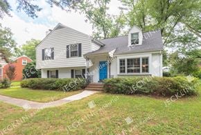 Henrico house for rent - A white house with a blue door and a small porch.