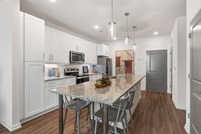 Duluth apartment for rent - A kitchen with a table and chairs in the middle of it.
