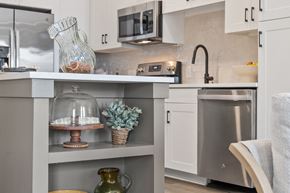 Cumming apartment for rent - A modern kitchen with a stainless steel refrigerator and microwave.