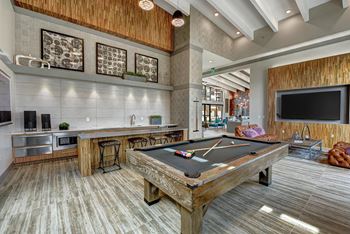 Resident lounge with billiards table and demonstration kitchen