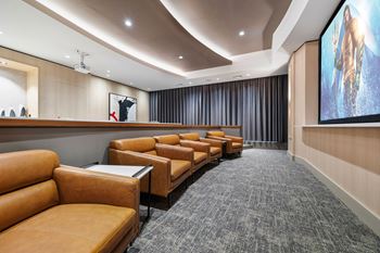 Screening lounge with hd projector and cinema-style seating