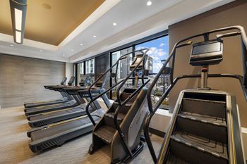 Cardio and strength training fitness center with echelon reflect mirror & bikes with on-demand classes, trx, and skillmill