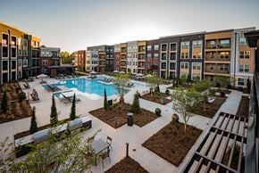 Duluth apartment for rent - an aerial view of the courtyard and pool at the bradley braddock road station apartments