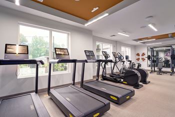 Cardio and strength training fitness center with techno-gym equipment