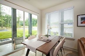 Richmond apartment for rent - A dining room with a table and chairs and a view of the outside.