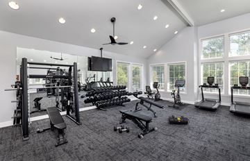 Richmond townhouse for rent - A spacious home gym with a variety of equipment.