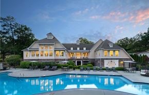 Richmond townhouse for rent - A large house with a pool in front.